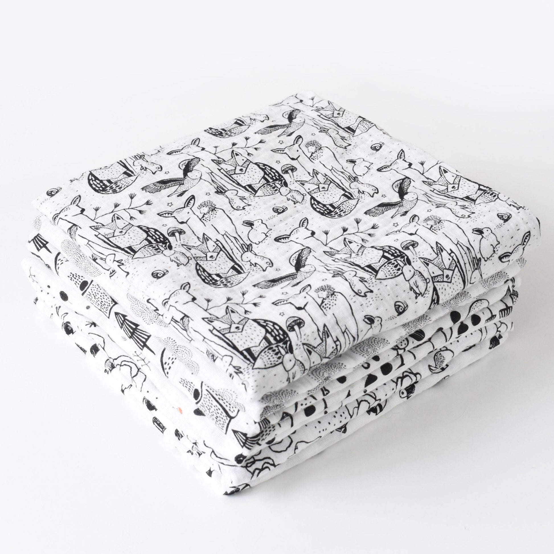 Folded fabric with black and white pattern on a white background