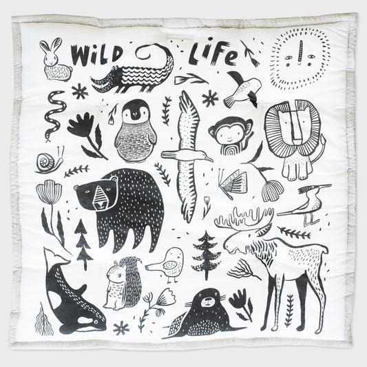 White blanket with black animal illustrations and 'Wild Life' text