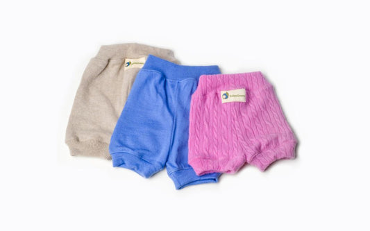 Three pairs of baby bloomers in gray, blue, and pink on a white background.