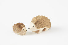 Load image into Gallery viewer, small and Large wooden hand carved Hedgehogs looking at each other on a white back ground
