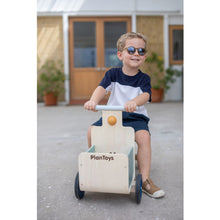Load image into Gallery viewer, Child playing with a Delivery Bike in Orchard  by plan toys
