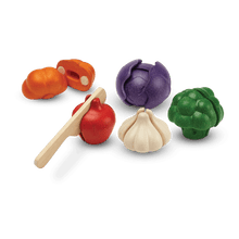 Load image into Gallery viewer, A wooden vegetable set, including garlic, broccoli, onion, pumpkin, and tomato. The tomato is being cut
