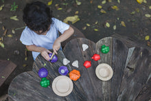 Load image into Gallery viewer, A child playing with a set of colorful wooden vegetables and wooden plates on a woo table
