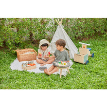 Load image into Gallery viewer, Kids playing outside BBQ Playset by Plan Toys on a blanket with a kids size tent
