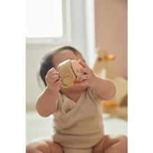 Load image into Gallery viewer, Baby holding Clapping Roller in Modern Rustic
