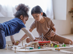 kids Playing withPlan Toys Road System