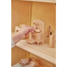 Load image into Gallery viewer, Child playing with PlanToys Victorian Furniture and Doll House
