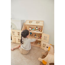 Load image into Gallery viewer, Child playing with PlanToys Victorian Furniture and Doll House
