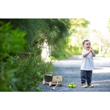 Load image into Gallery viewer, Child playing outside Kids with Black Wagon  by Plan Toys
