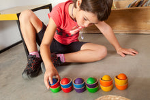 Load image into Gallery viewer, Child playing with rainbow bowls and balls
