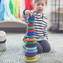 Load image into Gallery viewer, Child playing with stacking pebbles
