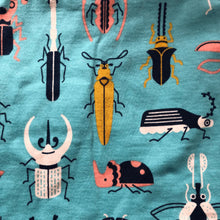 Load image into Gallery viewer, A close-up of a teal fabric with a colorful beetle print.
