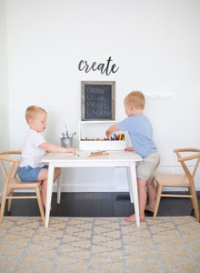 Natural crescent chairs by Milton and Goose in playroom