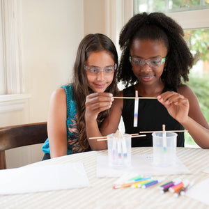 Children playing with the Paper Chromatography: The Art & Science of Color kit