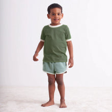 Load image into Gallery viewer, Kid wearing organic short sleeve tee and shorts by Winter Water Factory
