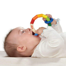 Load image into Gallery viewer, Baby chewing on Kringelring Teething Rattle by Haba
