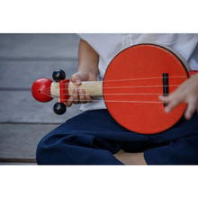 Load image into Gallery viewer, Child Playing a Banjo by Plan Toys
