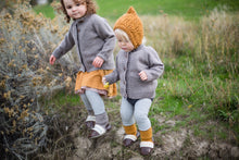 Load image into Gallery viewer, Kids playing outside wearing merino wool bonnets by Nook Design
