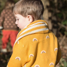Load image into Gallery viewer, Kid outdoors wearing &quot;From One To Another&quot; Rainbows sweater and a scarf
