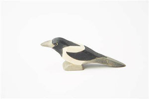 hand carved wooden Magpie by ostheimer on a white background
