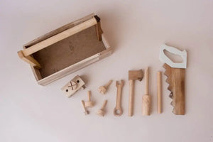 wooden tool set laid out on a flat surface