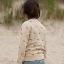 Load image into Gallery viewer, Child turned away from the cmera looking at the grasses at the beach From One To Another Rainbows Knitted Cardigan Sweater
