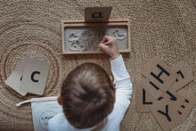 Load image into Gallery viewer, Kid practicing the letter &quot;a&quot; on a Sand Writing Tray 
