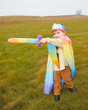 Load image into Gallery viewer, Child wearing a rainbow knight costume outside
