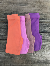 Load image into Gallery viewer, Stack of organic baby leggings
