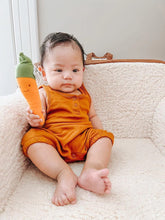 Load image into Gallery viewer, Baby with organic plush carrot teether by Under The Nile

