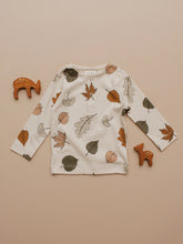 Load image into Gallery viewer, Organic Autumn Leaf Long-Sleeve Tee laid flat with deer figurines
