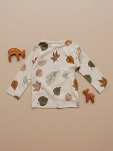 Organic Autumn Leaf Long-Sleeve Tee laid flat with deer figurines