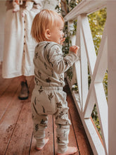 Load image into Gallery viewer, Baby wearing organic herb pants and long sleeve onesie set by Ziwi Baby
