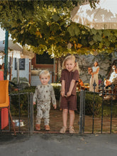 Load image into Gallery viewer, Children standing outside wearing Ziwi Baby organic sets
